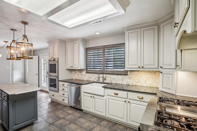 kitchen with tasteful backsplash, sink, a wealth of natural light, and appliances with stainless steel finishes