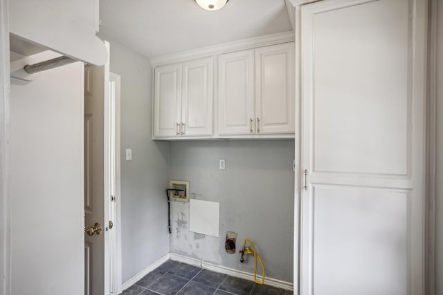 laundry room featuring dark tile patterned floors, washer hookup, cabinets, and hookup for a gas dryer