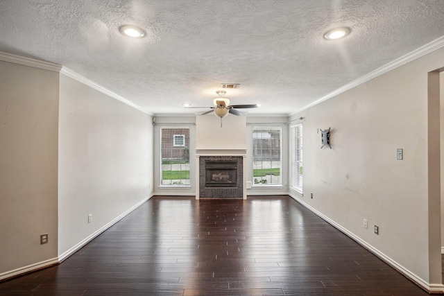 unfurnished living room featuring crown molding, dark hardwood / wood-style floors, and ceiling fan