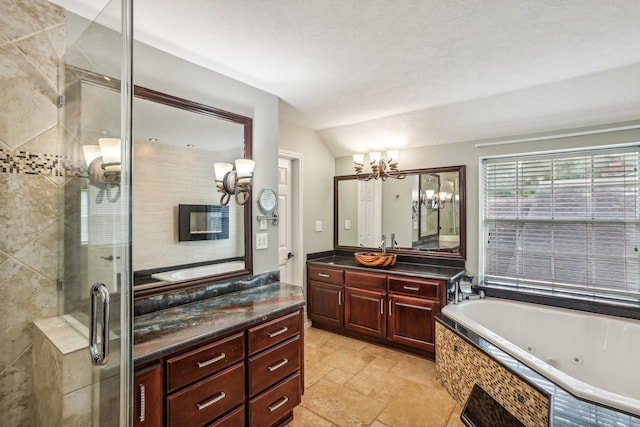 bathroom featuring vanity, a notable chandelier, lofted ceiling, and separate shower and tub