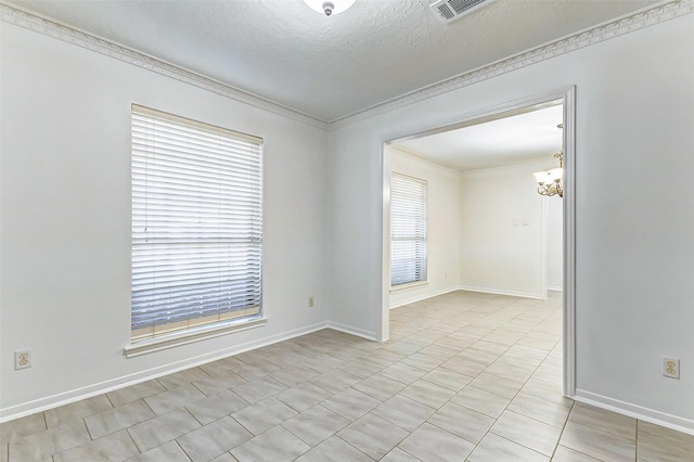 unfurnished room with crown molding, an inviting chandelier, and a textured ceiling