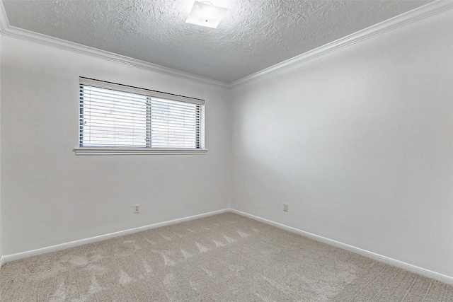 carpeted spare room with crown molding and a textured ceiling