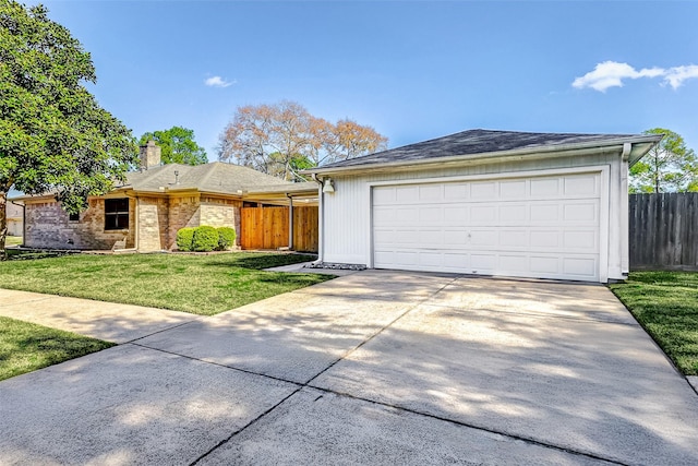 ranch-style house with a garage and a front yard