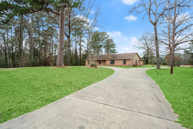 ranch-style home featuring a front yard