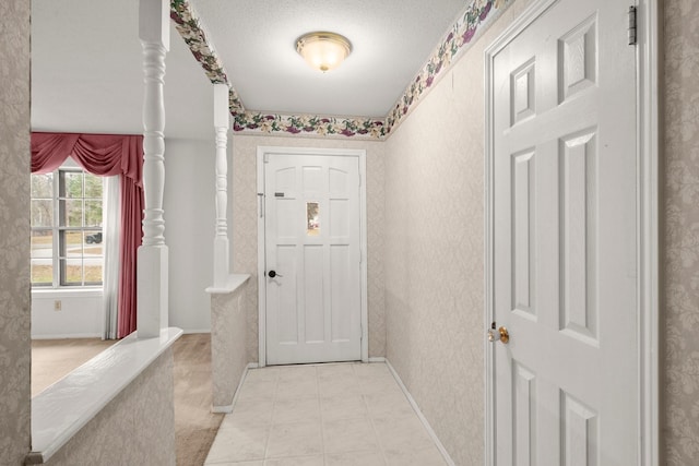 entryway featuring a textured ceiling