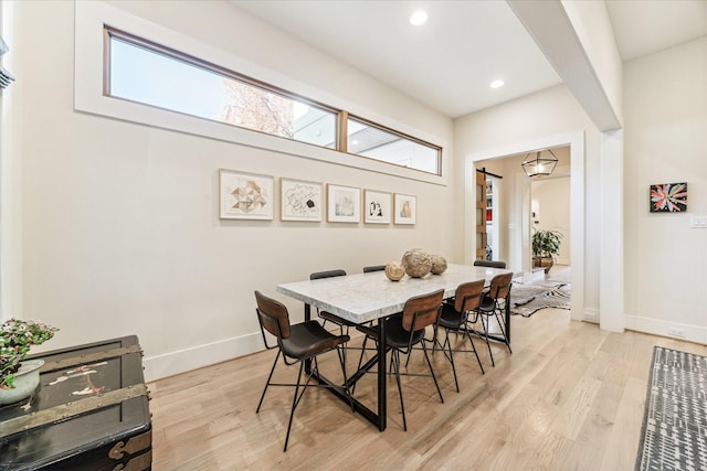 dining area featuring light wood-type flooring