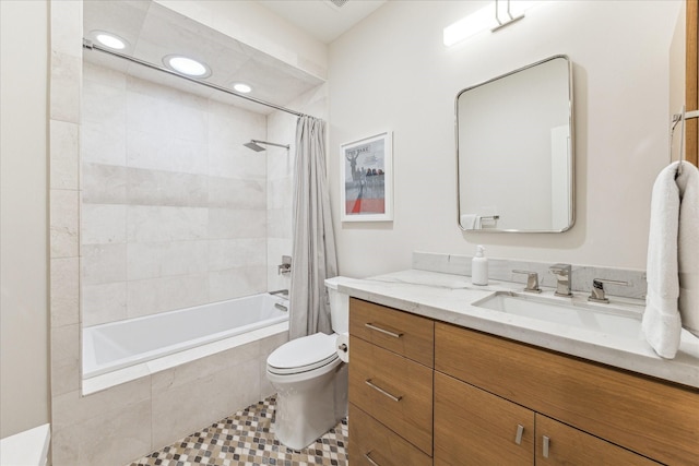 full bathroom with shower / bathtub combination with curtain, vanity, and toilet