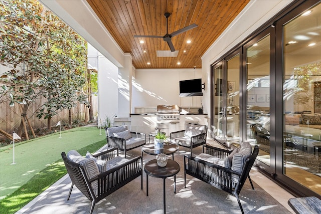 view of patio / terrace featuring an outdoor kitchen, ceiling fan, an outdoor hangout area, and area for grilling