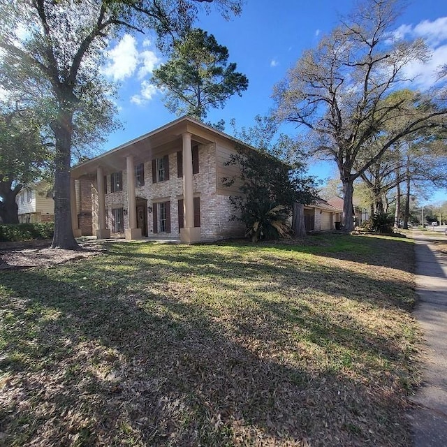 view of side of home featuring a lawn