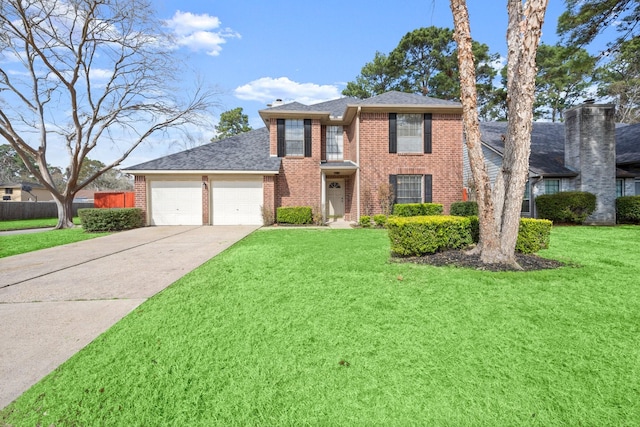 view of front of home with a garage and a front yard