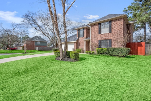 view of front of house featuring a garage and a front yard