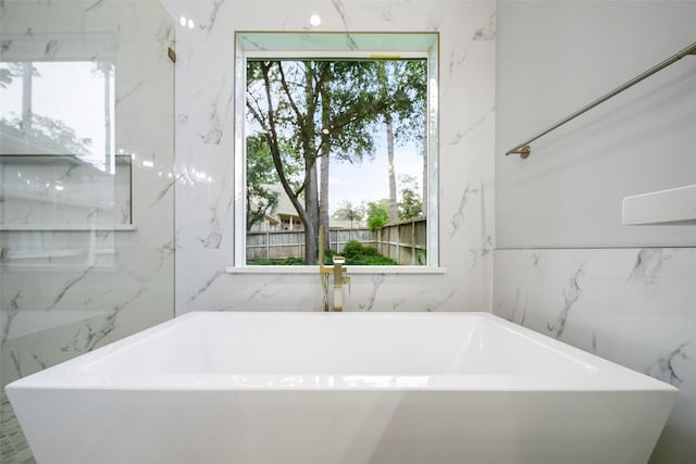 bathroom featuring a bath