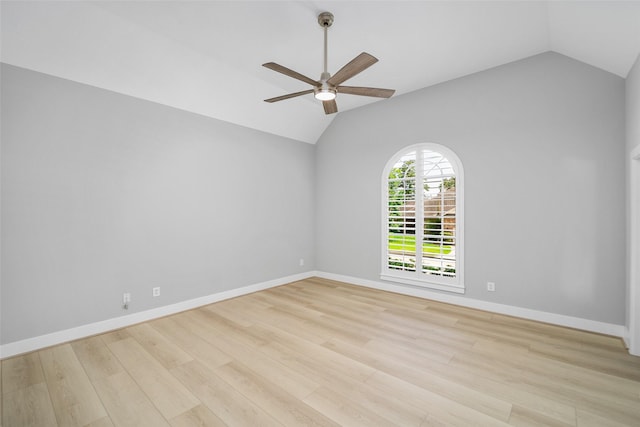 unfurnished room featuring ceiling fan, vaulted ceiling, and light wood-type flooring