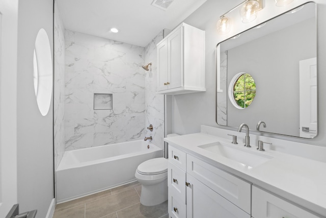 full bathroom featuring vanity, toilet, and tiled shower / bath combo