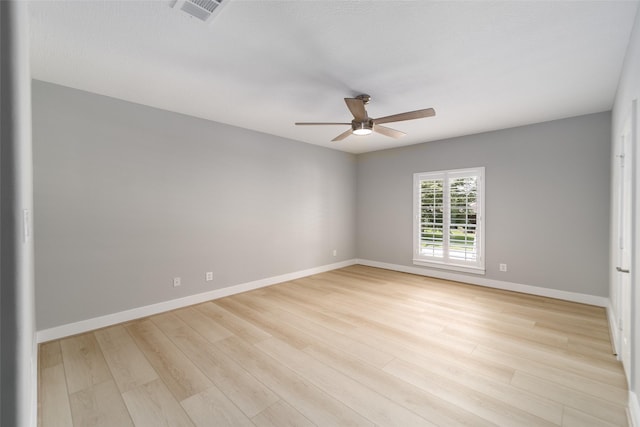 unfurnished room with ceiling fan and light hardwood / wood-style floors