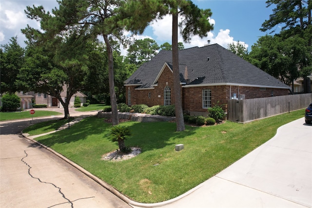 view of home's exterior with a yard