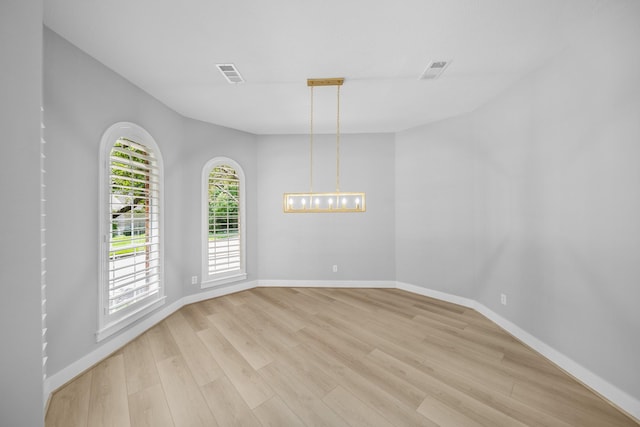 spare room featuring light hardwood / wood-style floors