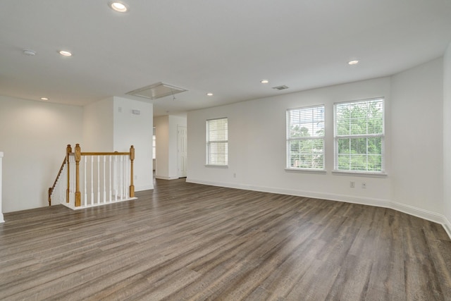 empty room with dark wood-type flooring