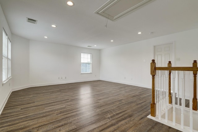 spare room featuring dark hardwood / wood-style floors