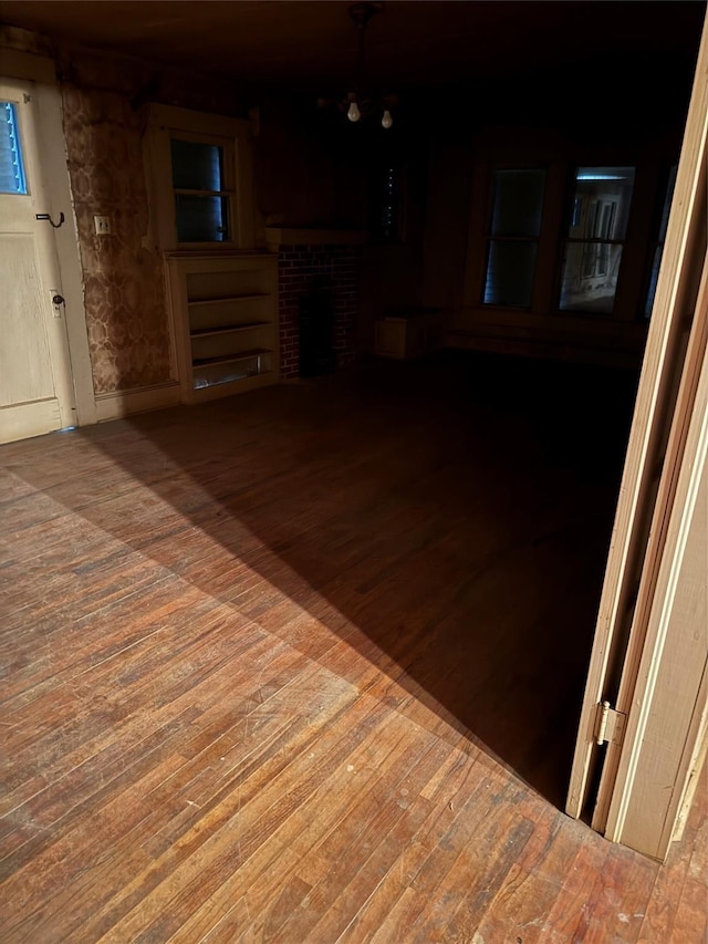 interior space featuring wood-type flooring and a fireplace