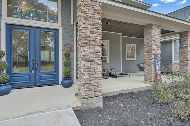 entrance to property with a patio and french doors