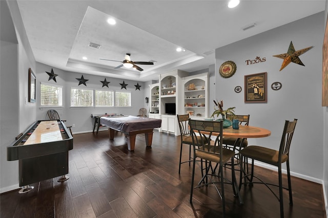 playroom with dark hardwood / wood-style floors, ceiling fan, a tray ceiling, and pool table