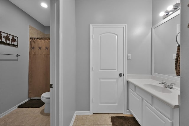 bathroom featuring vanity, curtained shower, tile patterned floors, and toilet