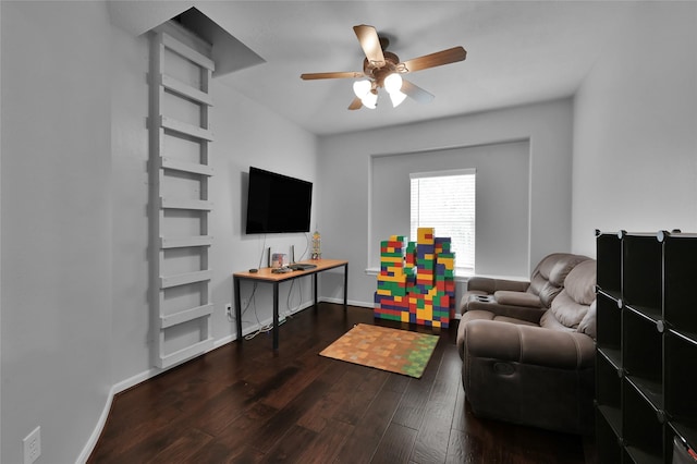 living room featuring ceiling fan and dark hardwood / wood-style flooring