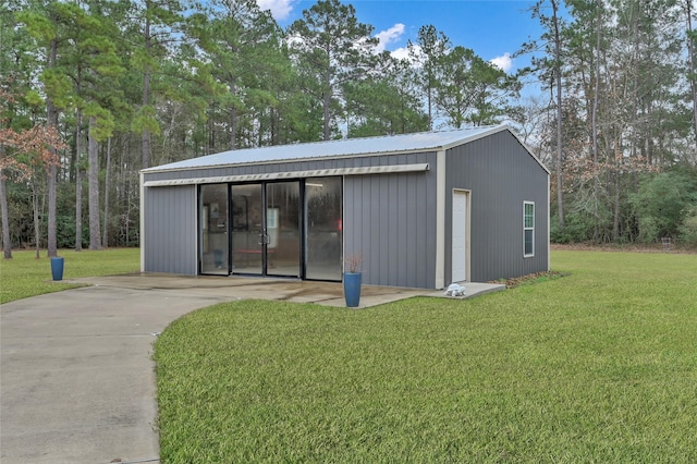 view of outbuilding featuring a yard