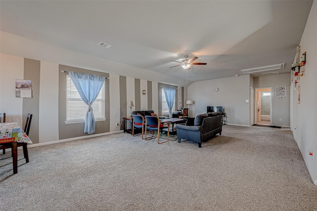 carpeted living room featuring ceiling fan and lofted ceiling