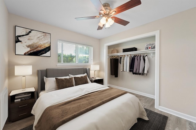 bedroom featuring hardwood / wood-style floors, a closet, and ceiling fan