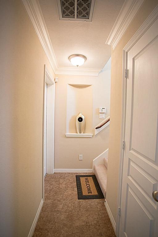 hallway featuring ornamental molding