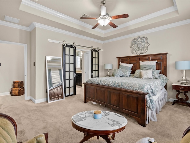 bedroom with crown molding, ceiling fan, a raised ceiling, light colored carpet, and a barn door