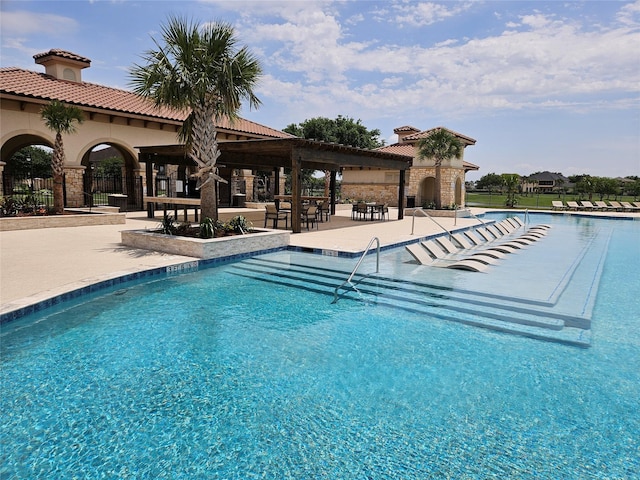 view of swimming pool featuring a patio area