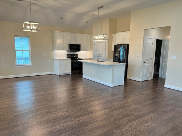 kitchen featuring hanging light fixtures, sink, white cabinets, and black appliances