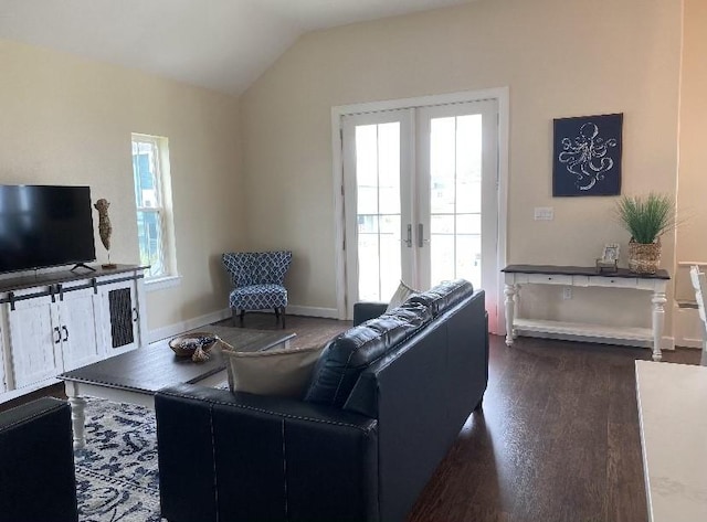 living room with lofted ceiling, dark wood-type flooring, and french doors