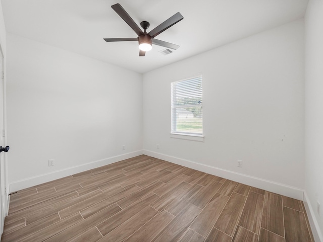 unfurnished room with ceiling fan