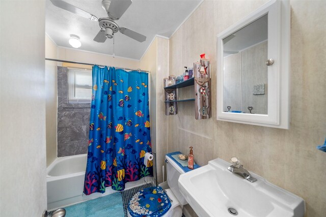 full bathroom with sink, shower / tub combo with curtain, ceiling fan, and toilet