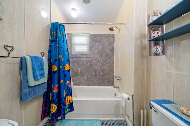 bathroom with shower / tub combo with curtain and toilet