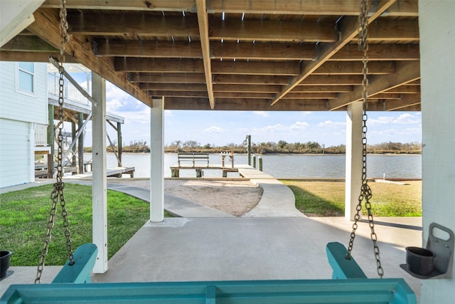 view of patio featuring a water view and a dock