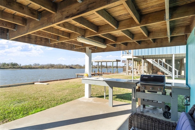 view of patio with a water view