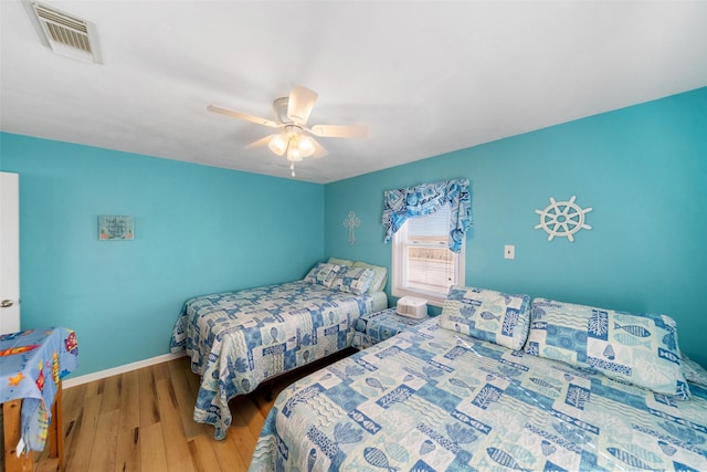 bedroom featuring hardwood / wood-style flooring and ceiling fan