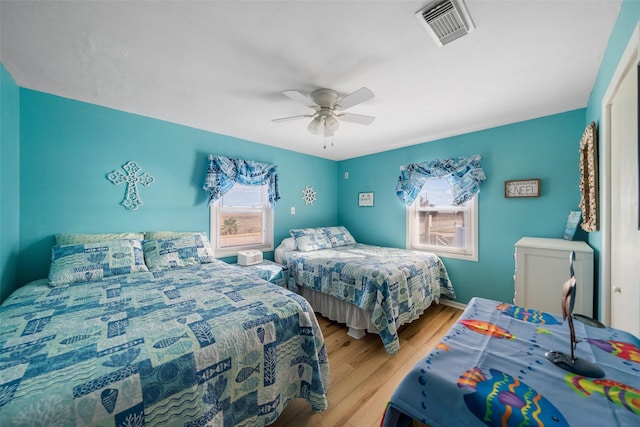 bedroom featuring ceiling fan and light wood-type flooring