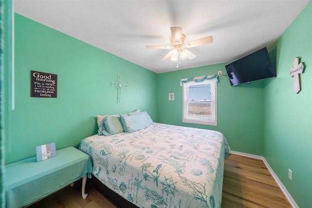 bedroom featuring hardwood / wood-style flooring and ceiling fan