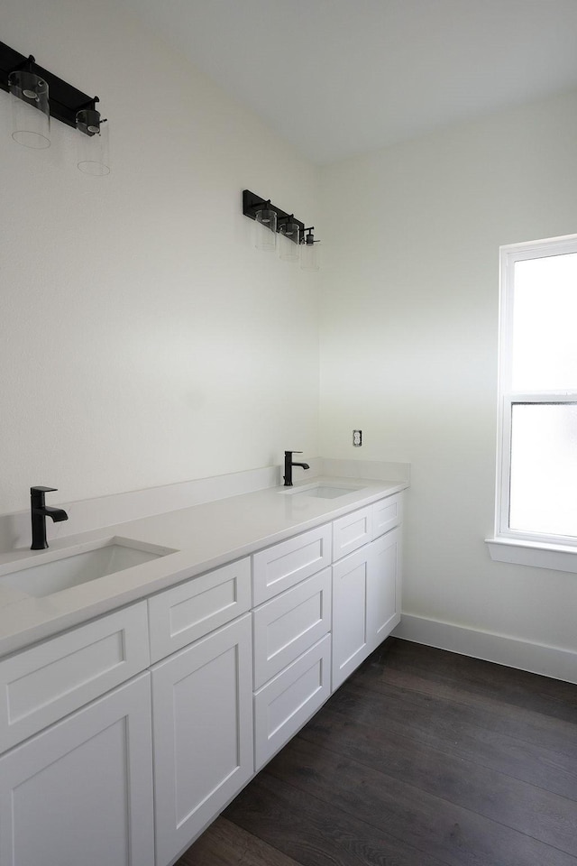 bathroom featuring vanity and hardwood / wood-style floors