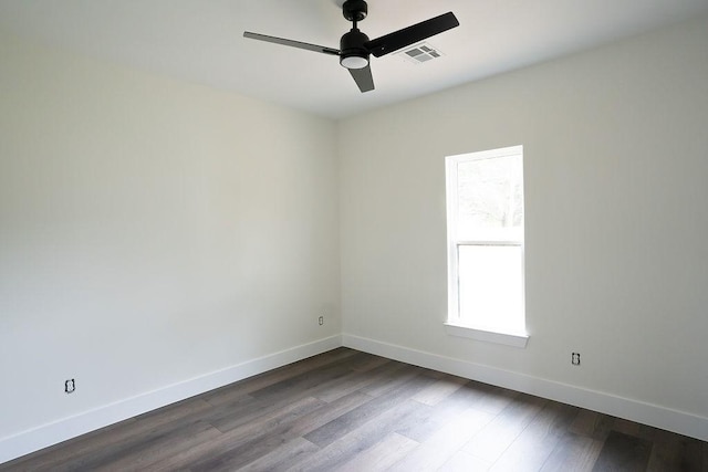 empty room featuring hardwood / wood-style flooring and ceiling fan