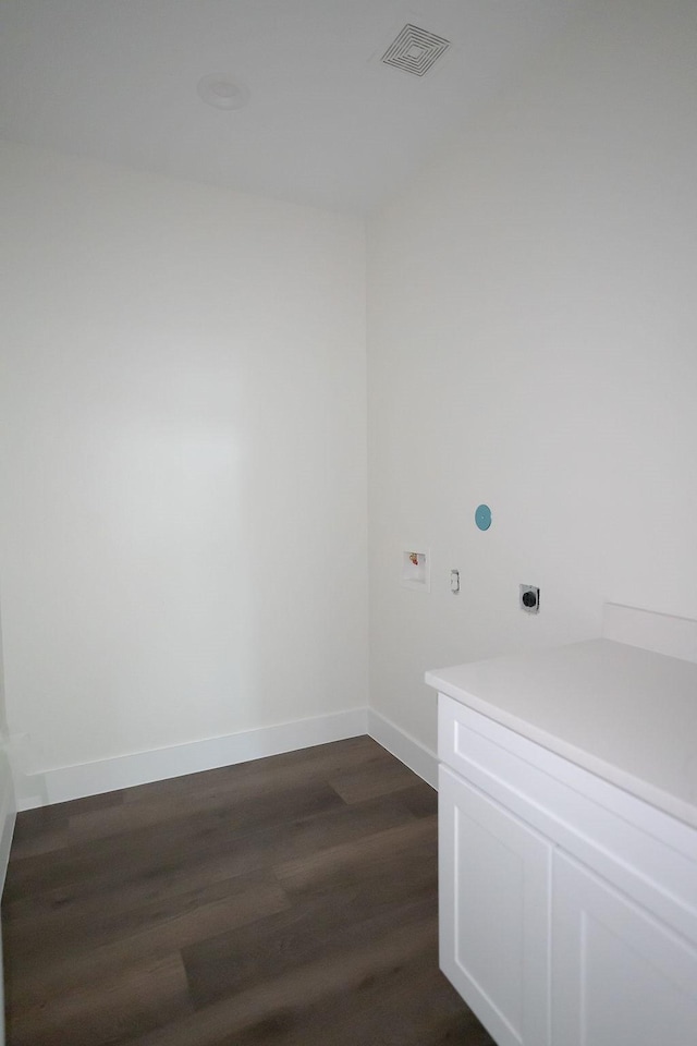 laundry area featuring cabinets, washer hookup, dark wood-type flooring, and hookup for an electric dryer