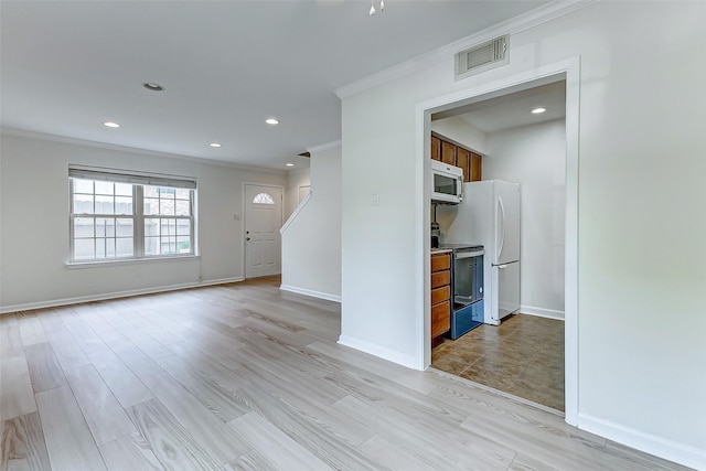 unfurnished living room with crown molding and light hardwood / wood-style flooring