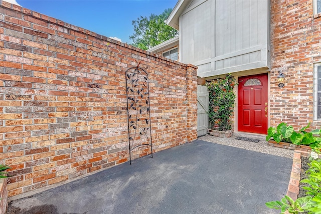 doorway to property featuring a patio area