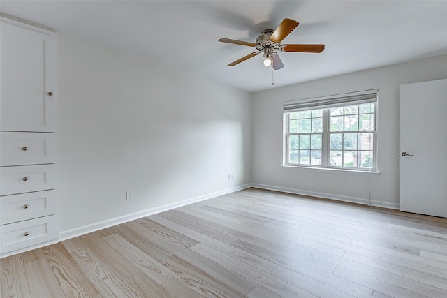 spare room with ceiling fan and light hardwood / wood-style flooring